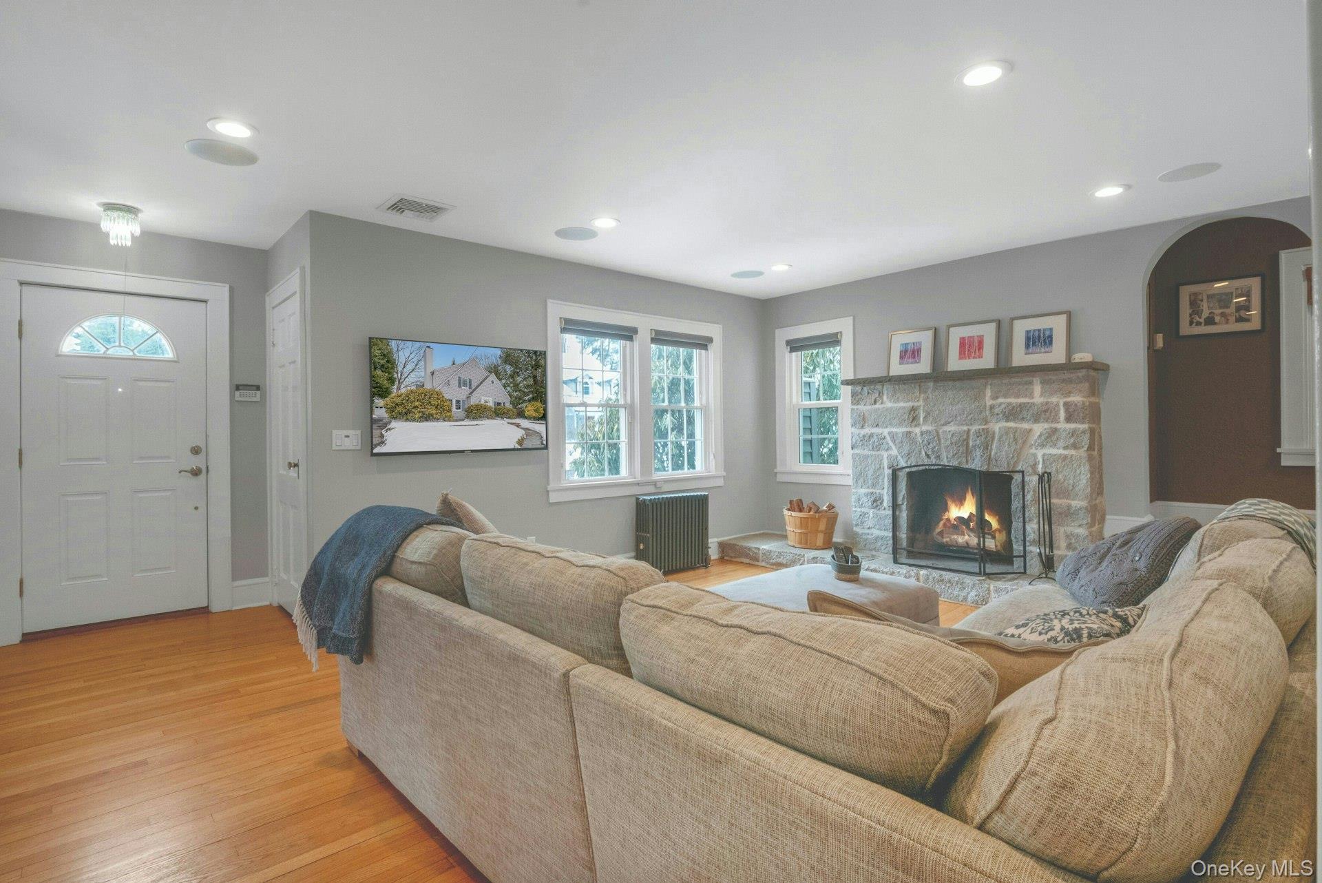 25 Maple Road Briarcliff Manor, NY 10510 - Photo 4 of 48 Fabulous Family Room with stunning stone wood-burning fireplace & loads of natural light plus recessed lighting.