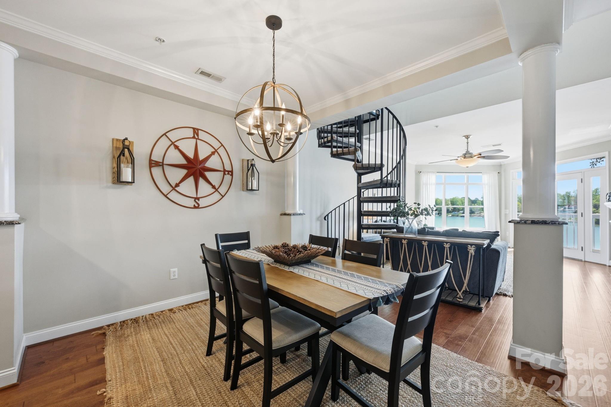 637 Williamson Road, Unit 307 Mooresville, NC 28117 - Photo 11 of 44 a view of a dining room with furniture window and wooden floor