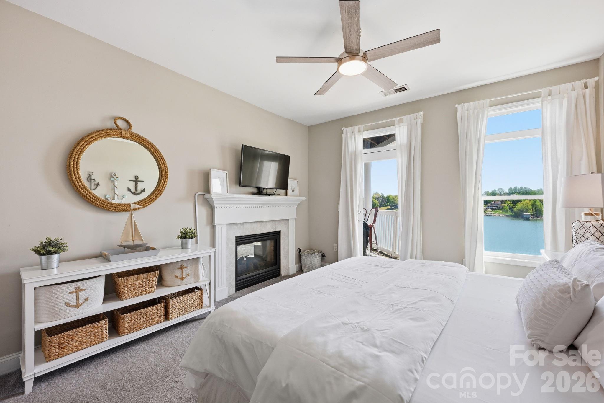 637 Williamson Road, Unit 307 Mooresville, NC 28117 - Photo 16 of 44 a bedroom with a large bed and a chandelier