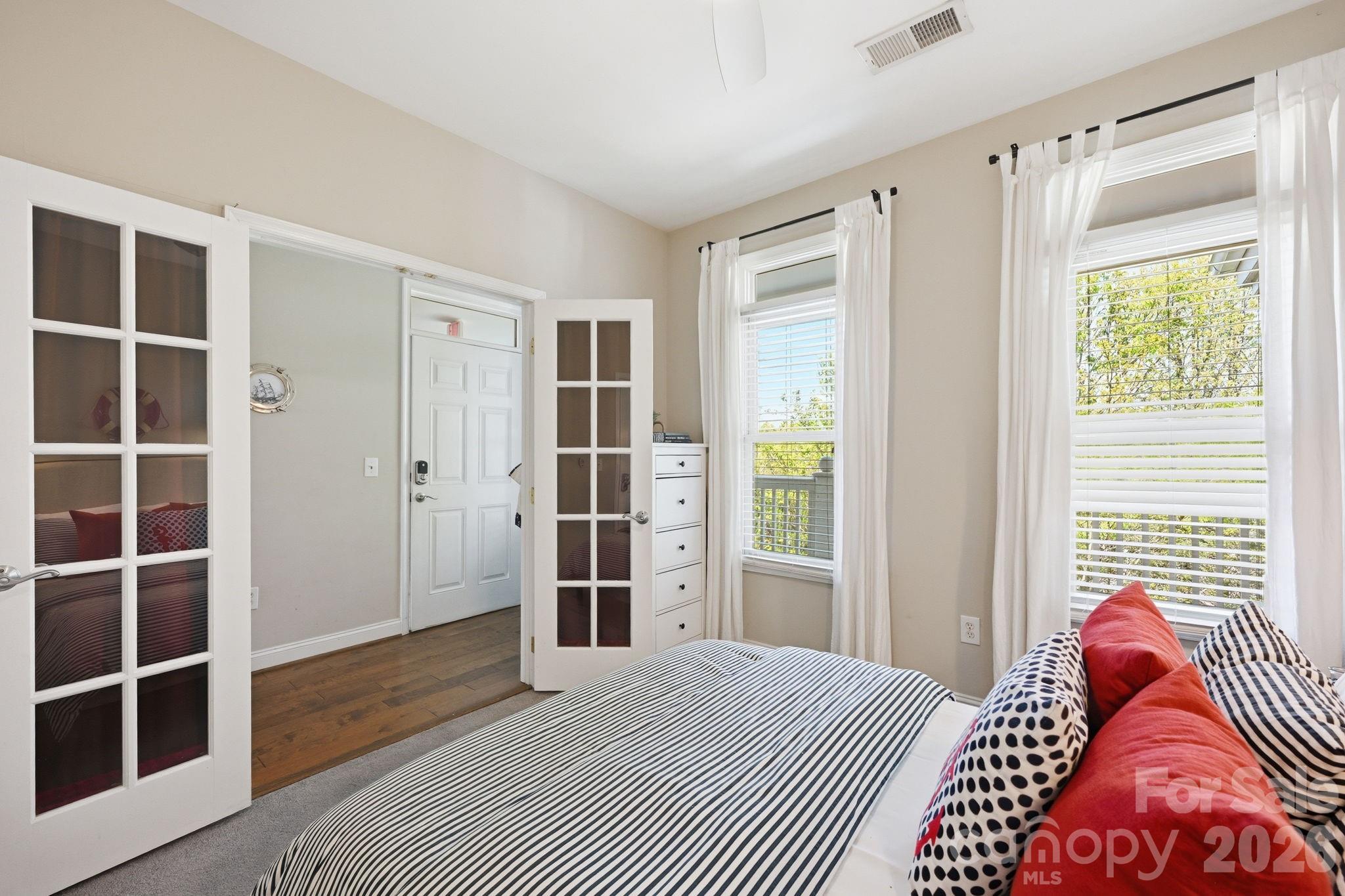 637 Williamson Road, Unit 307 Mooresville, NC 28117 - Photo 20 of 44 a bedroom with a bed and walk in closet