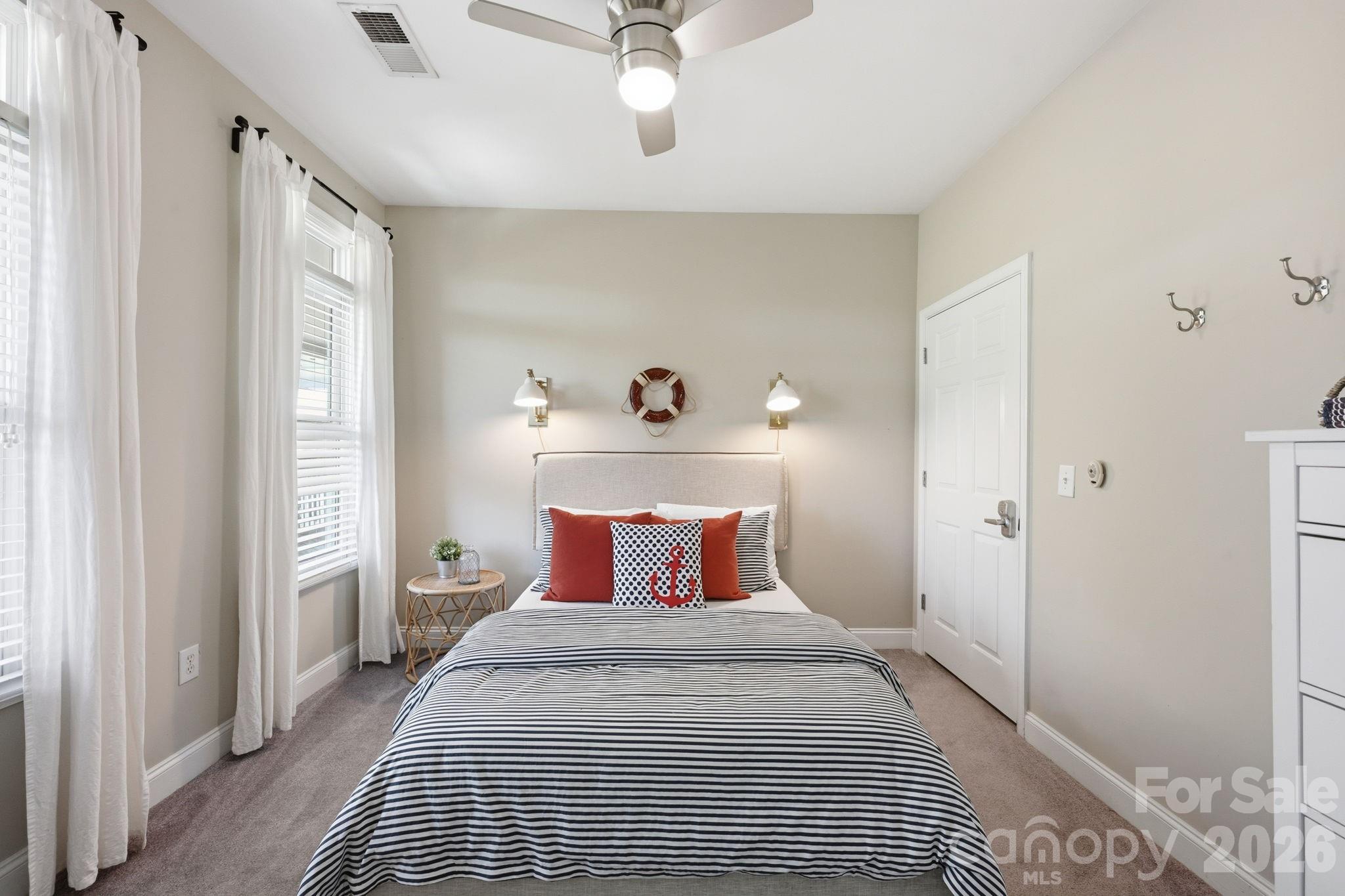 637 Williamson Road, Unit 307 Mooresville, NC 28117 - Photo 21 of 44 a bedroom with a bed and a window