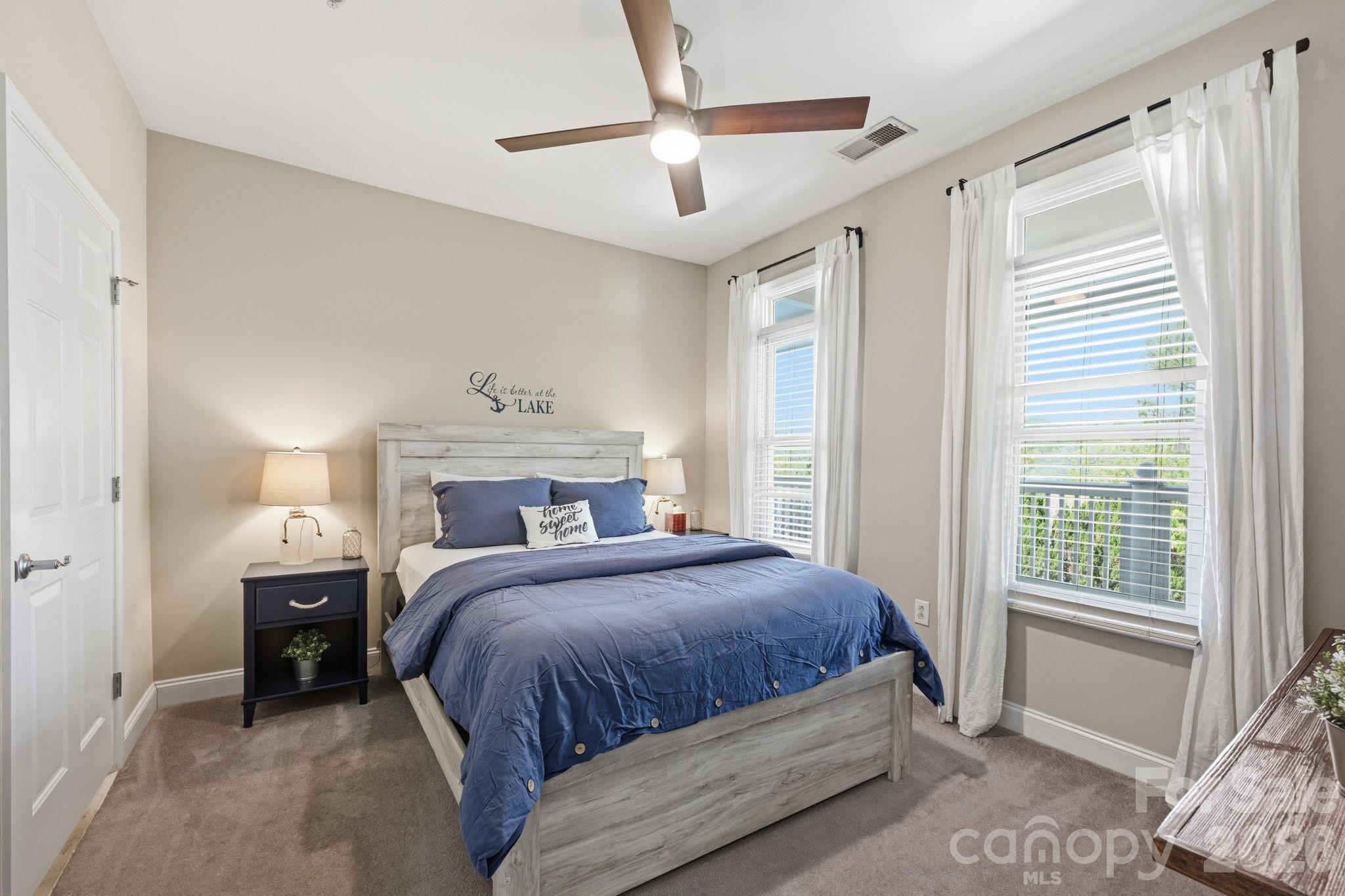 637 Williamson Road, Unit 307 Mooresville, NC 28117 - Photo 24 of 44 a bedroom with a large bed and a window