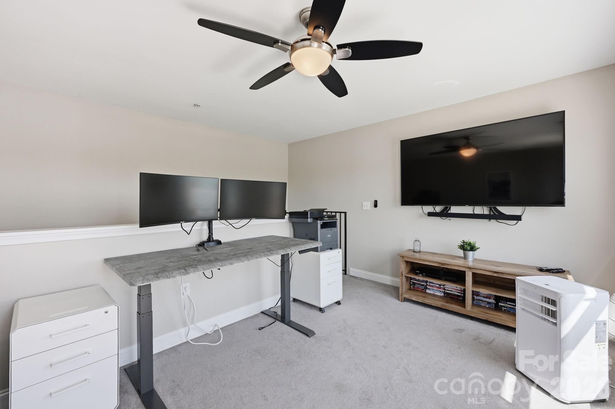 637 Williamson Road, Unit 307 Mooresville, NC 28117 - Photo 26 of 44 a view of a livingroom with furniture and a flat screen tv
