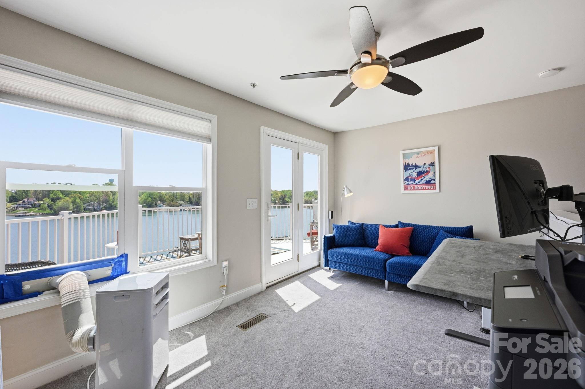 637 Williamson Road, Unit 307 Mooresville, NC 28117 - Photo 27 of 44 a living room with furniture and a large window