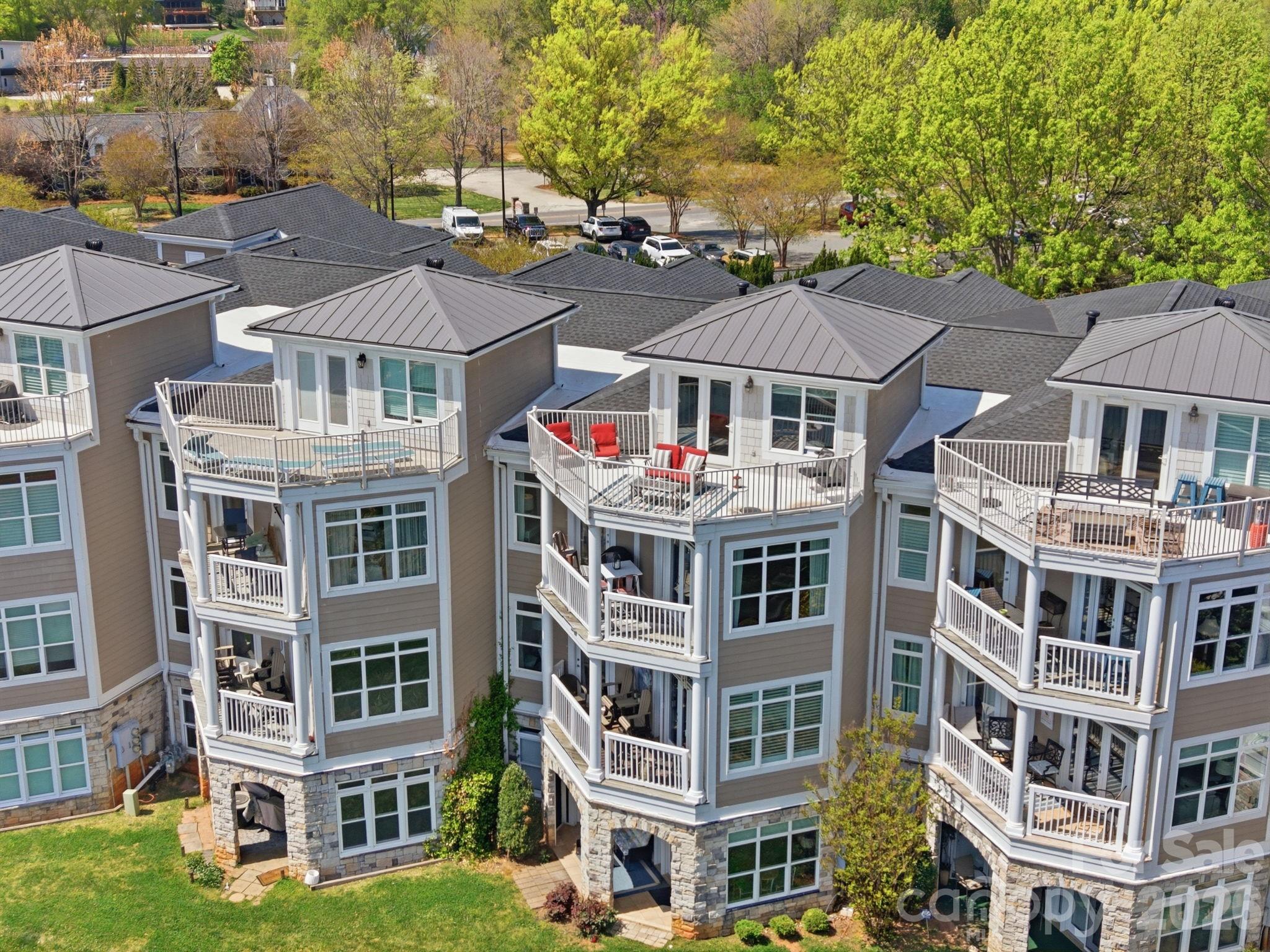 637 Williamson Road, Unit 307 Mooresville, NC 28117 - Photo 37 of 44 a front view of a residential apartment building with a yard