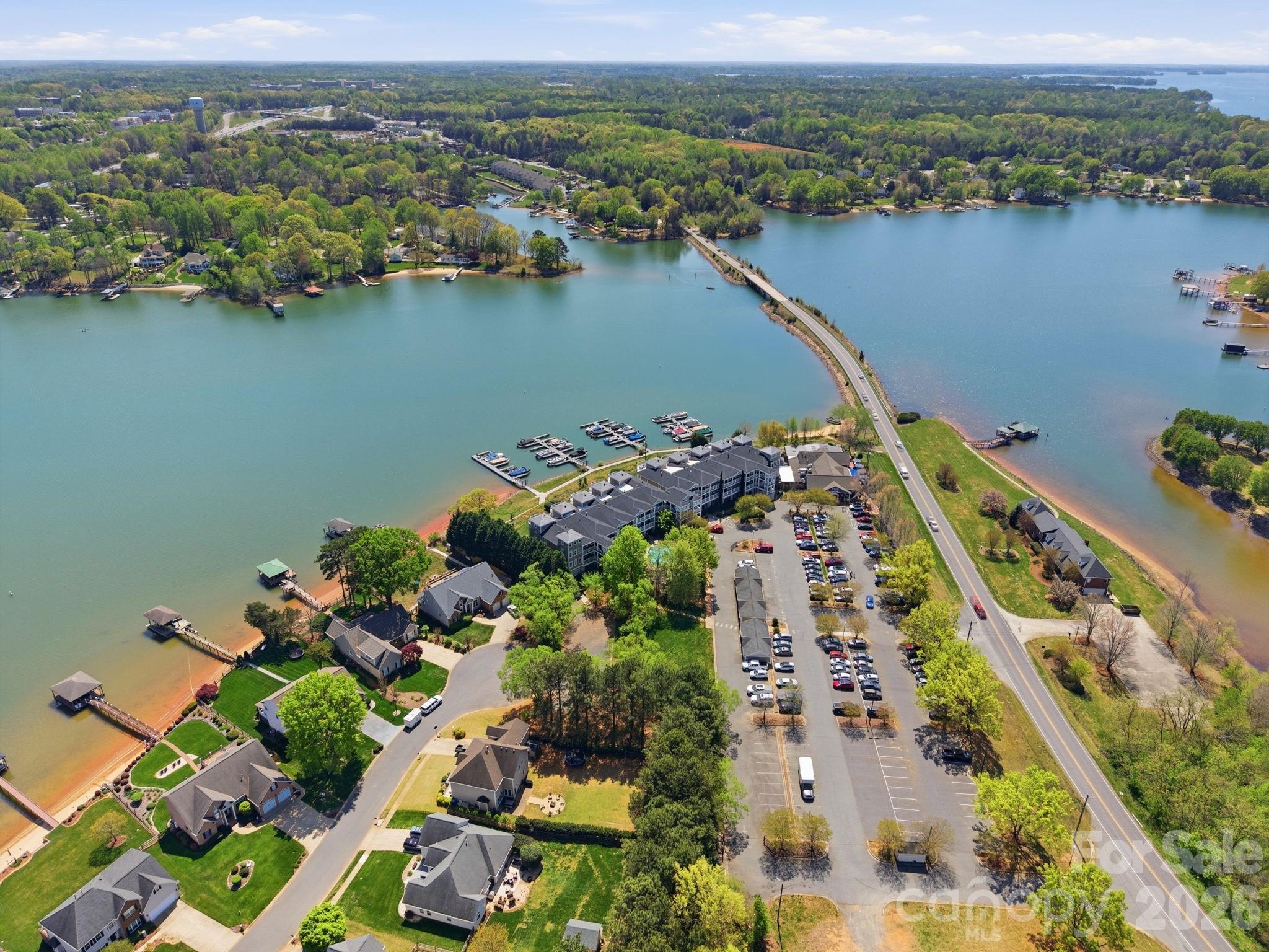 637 Williamson Road, Unit 307 Mooresville, NC 28117 - Photo 42 of 44 an aerial view of lake and residential houses with outdoor space