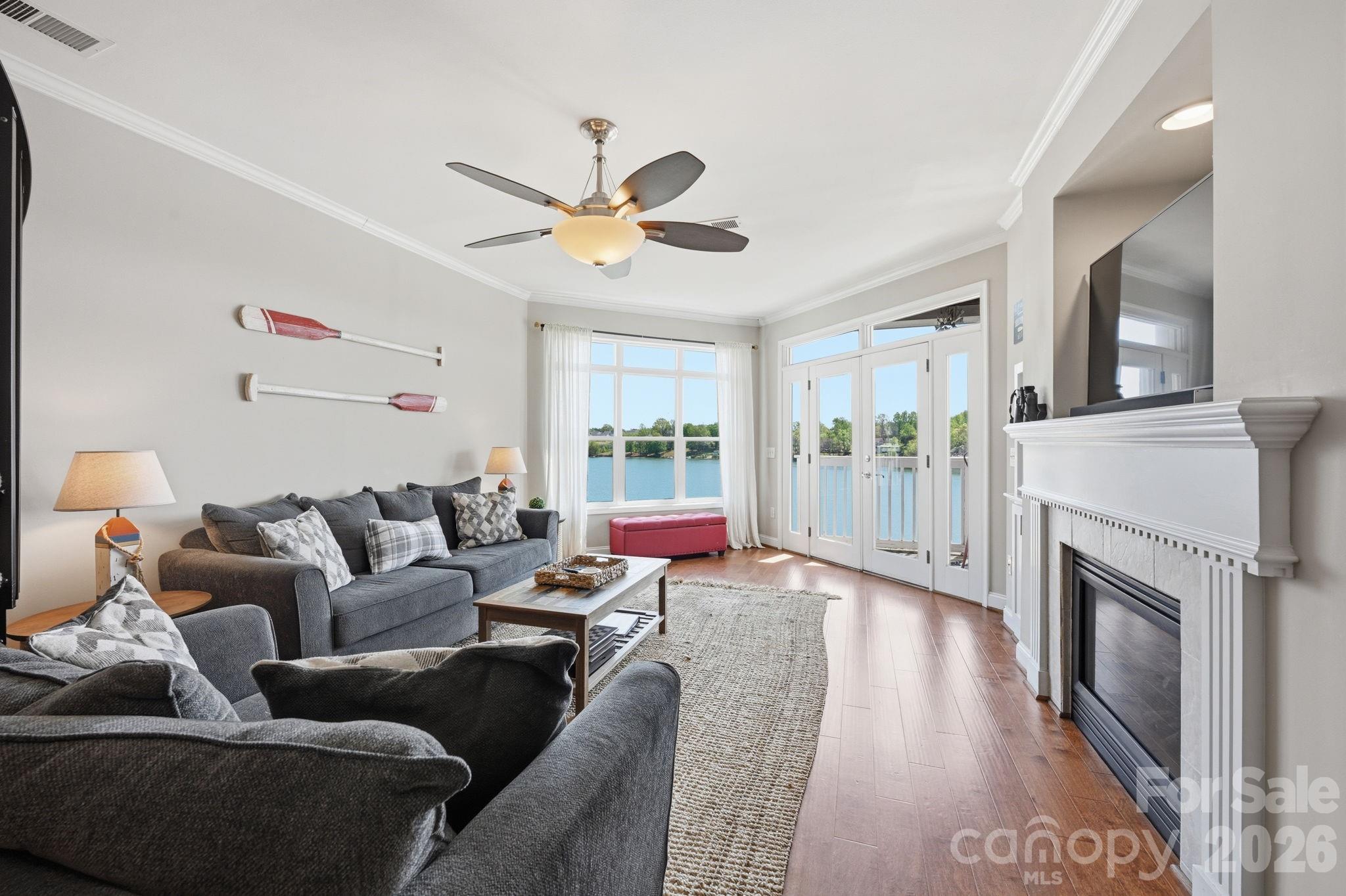 637 Williamson Road, Unit 307 Mooresville, NC 28117 - Photo 5 of 44 a living room with furniture and a fireplace