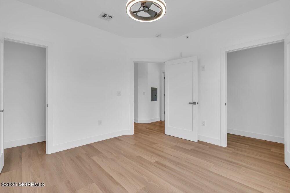 629-631 Highway 88, Unit 13 Point Pleasant, NJ 08742 - Photo 19 of 28 a view of an empty room with wooden floor