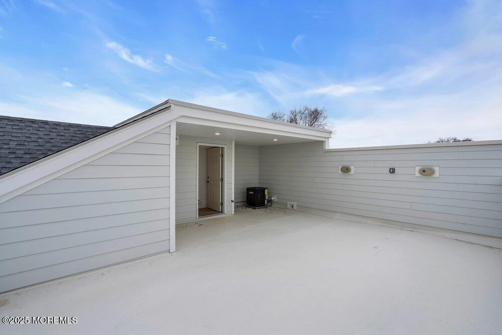 629-631 Highway 88, Unit 13 Point Pleasant, NJ 08742 - Photo 2 of 28 a view of a house with a balcony