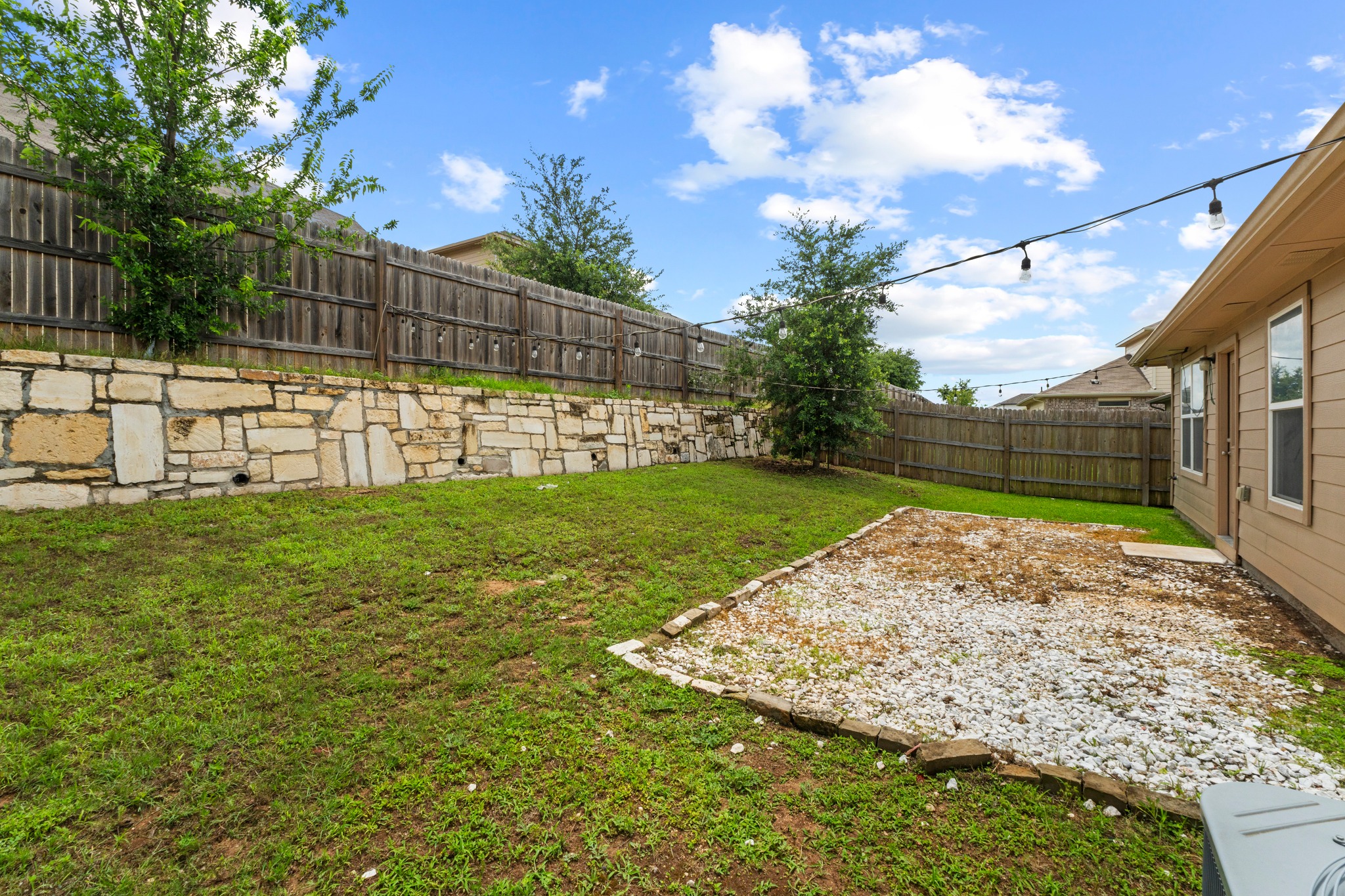 10809 Gonzales Ranger Pass Austin, TX 78754 - Photo 30 of 37 The perfectly sized fenced-in yard provides ample space to play and grow and plenty of room for future enhancements.