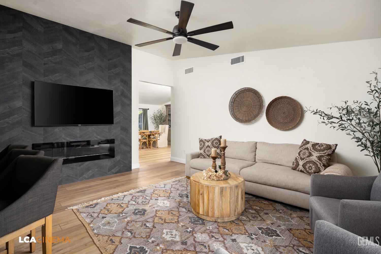 Undisclosed Address Bakersfield, CA 93312 - Photo 1 of 28 a living room with furniture and a flat screen tv