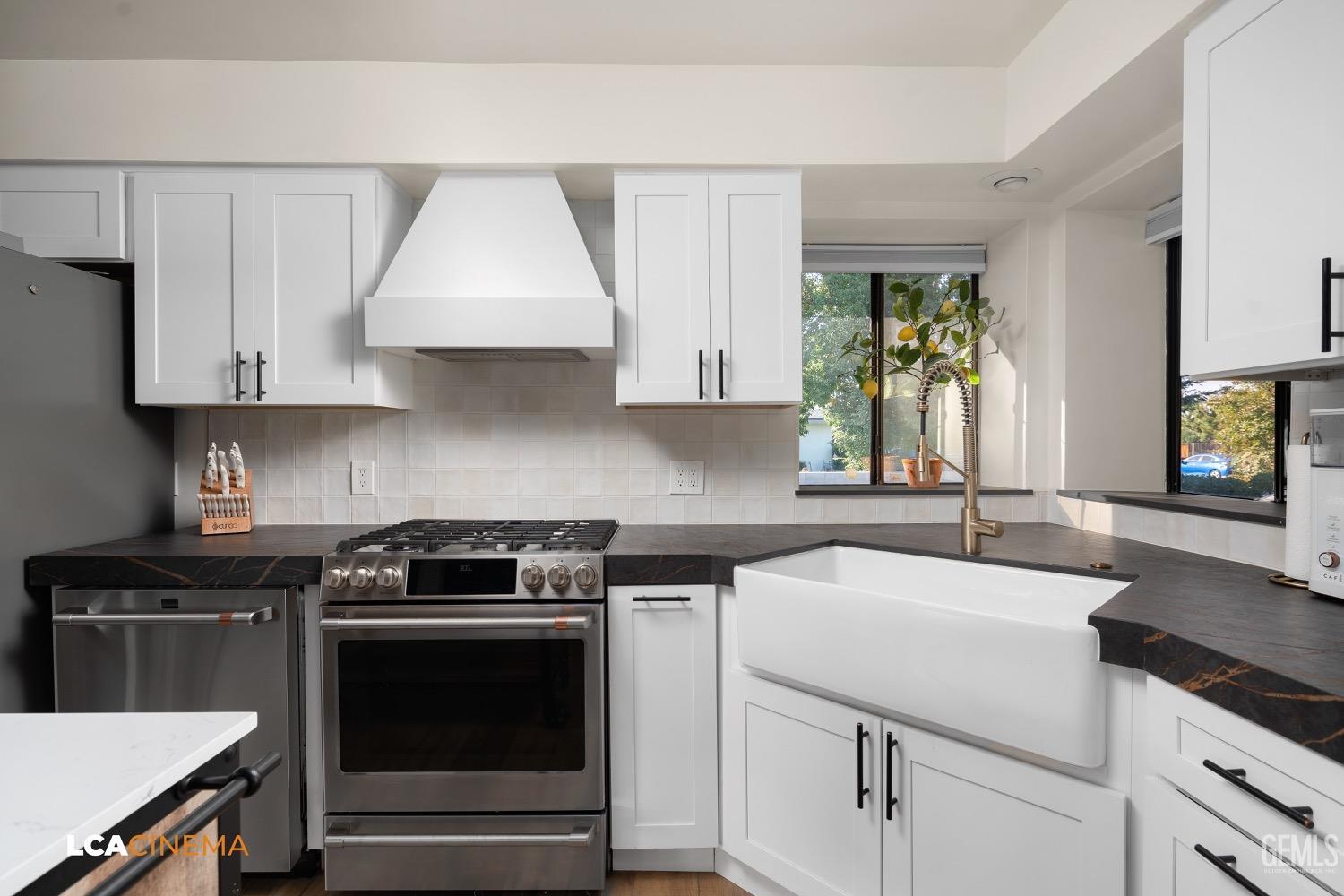 Undisclosed Address Bakersfield, CA 93312 - Photo 11 of 28 a kitchen with a sink stove and cabinets