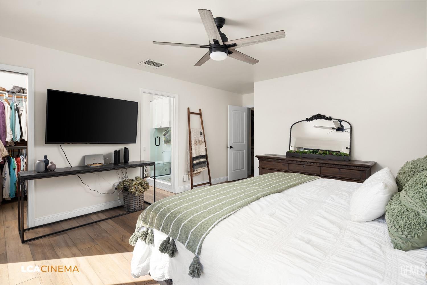 Undisclosed Address Bakersfield, CA 93312 - Photo 14 of 28 a bedroom with a bed and a flat screen tv