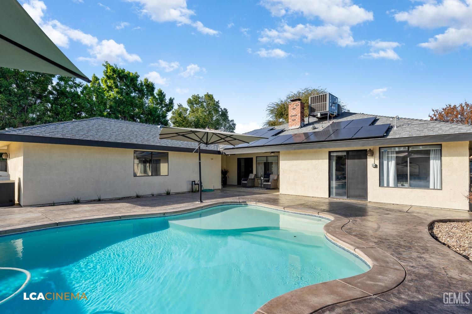 Undisclosed Address Bakersfield, CA 93312 - Photo 22 of 28 a front view of a house with a garden and yard