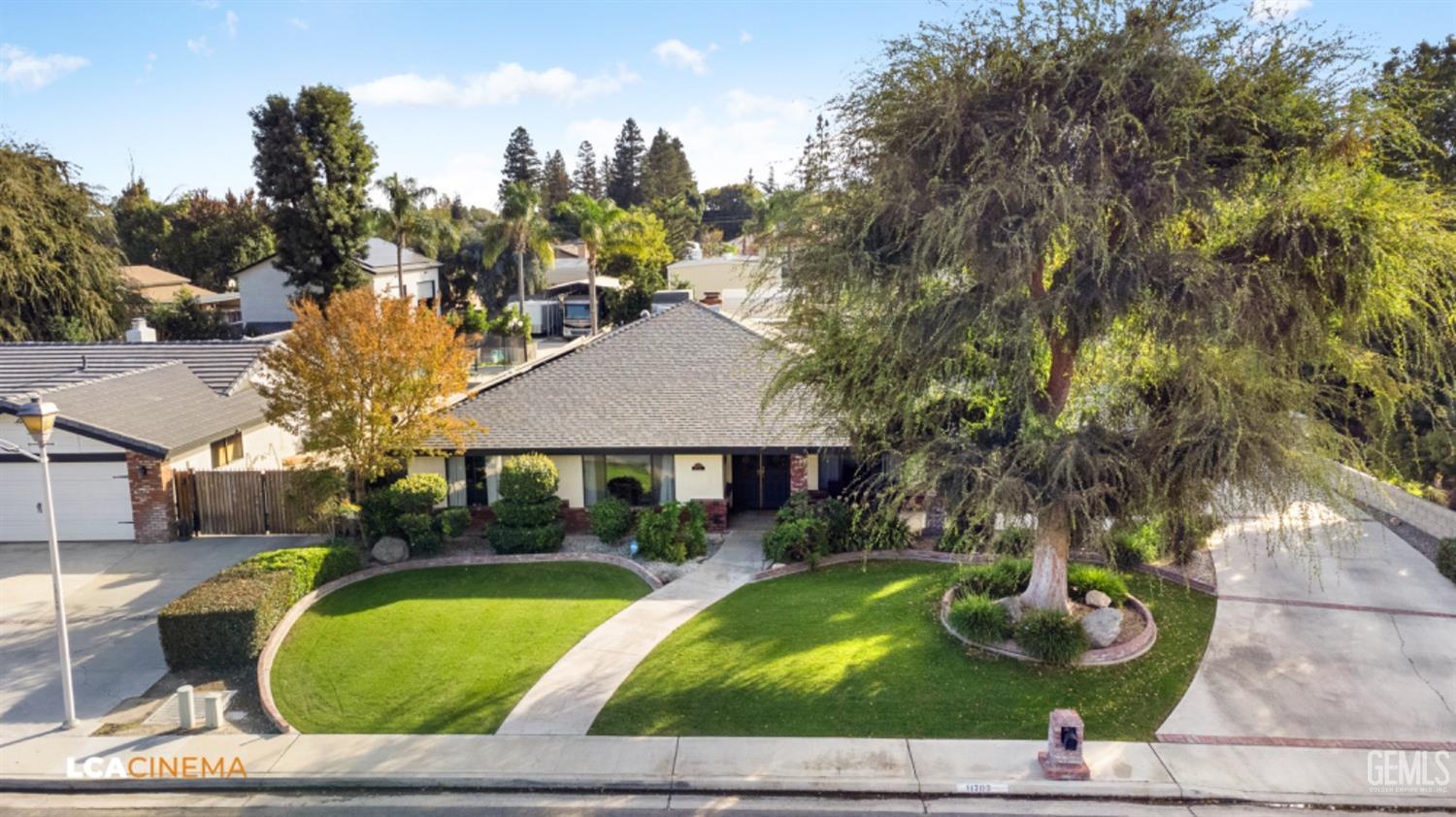 Undisclosed Address Bakersfield, CA 93312 - Photo 25 of 28 a front view of a house with garden