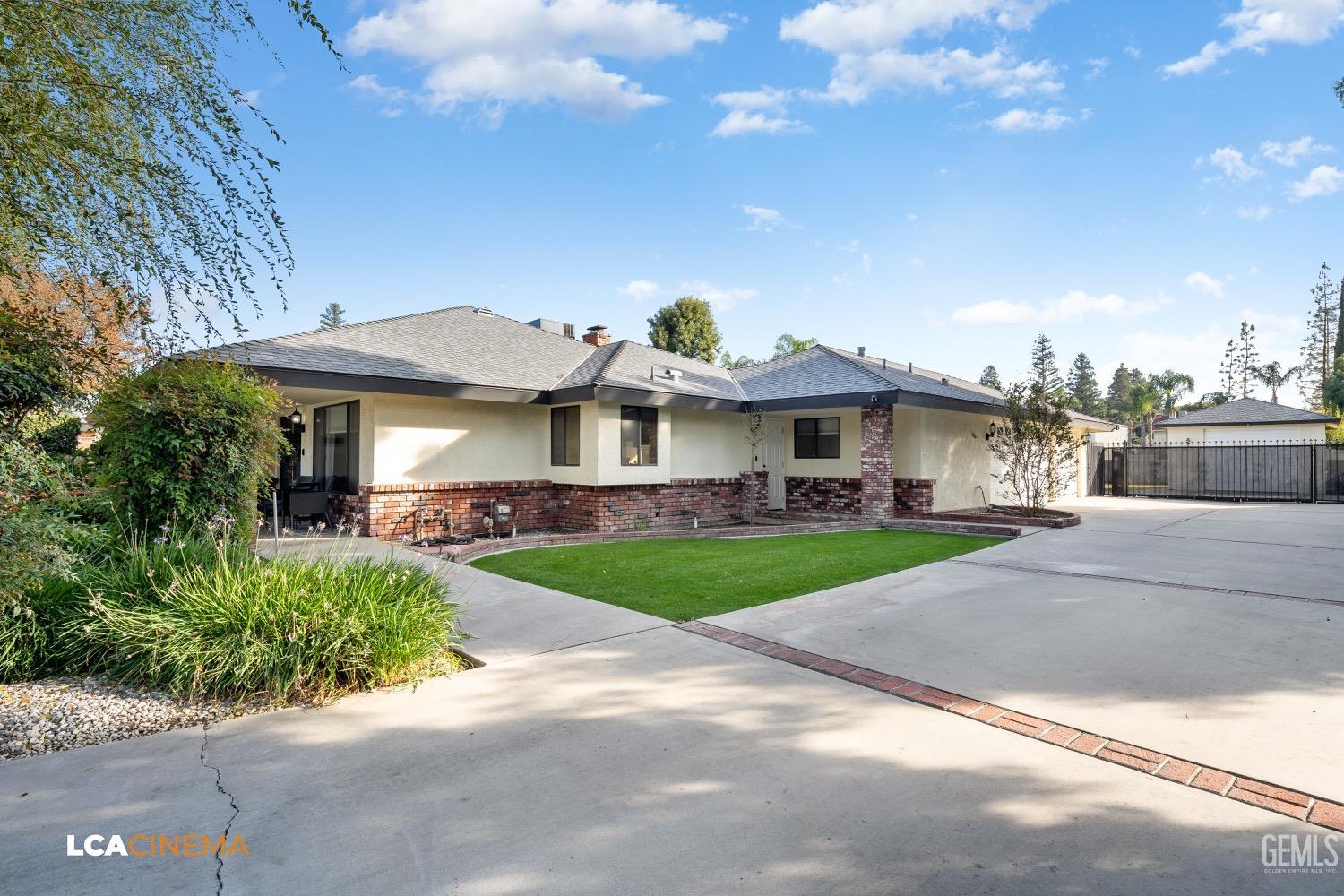 Undisclosed Address Bakersfield, CA 93312 - Photo 28 of 28 a front view of a house with garden