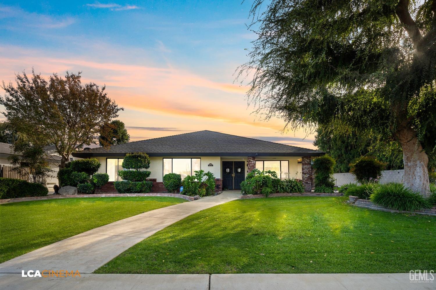 Undisclosed Address Bakersfield, CA 93312 - Photo 3 of 28 a front view of a house with a yard