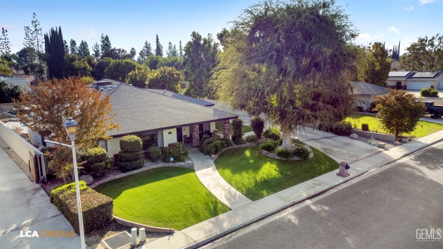 Undisclosed Address Bakersfield, CA 93312 - Photo 4 of 28 an aerial view of a house with swimming pool and big yard