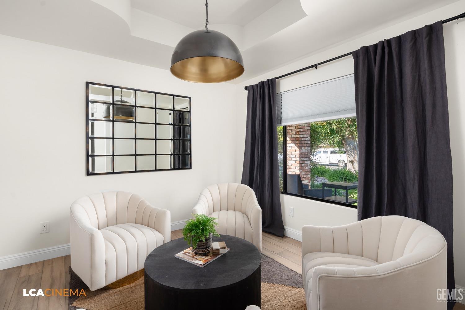 Undisclosed Address Bakersfield, CA 93312 - Photo 8 of 28 a living room with furniture and a large window