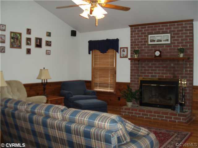 4035 Doe Run Road Hopewell, VA 23860 - Photo 3 of 12 a bedroom with bed and a fireplace