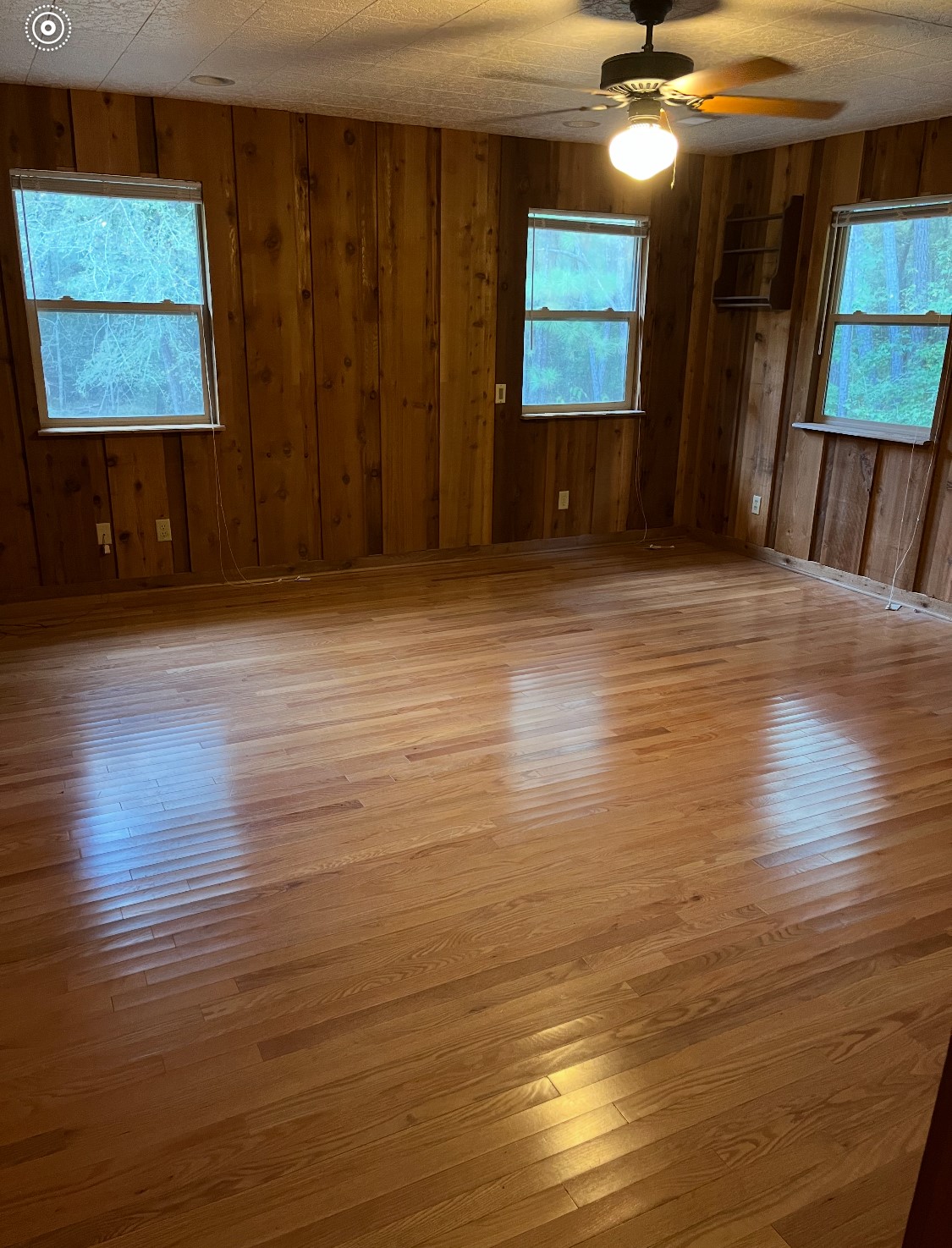 65 Farm To Market Road 3454 Huntsville, TX 77320 - Photo 17 of 37 an empty room with wooden floor and windows