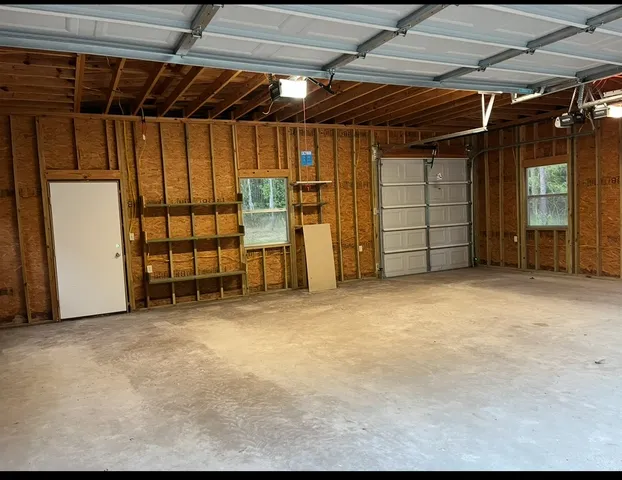 a view of a room with wooden walls