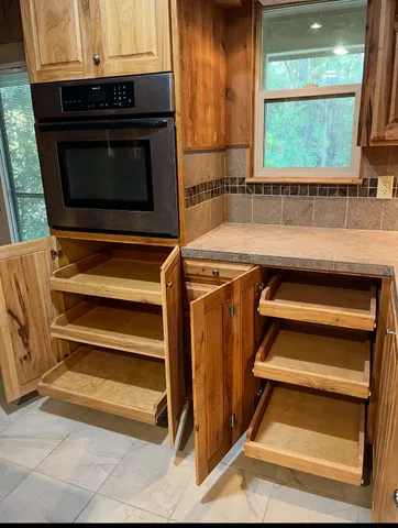 a view of a kitchen with a sink and a window