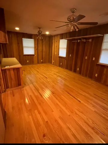 a bedroom with a bed and a mirror