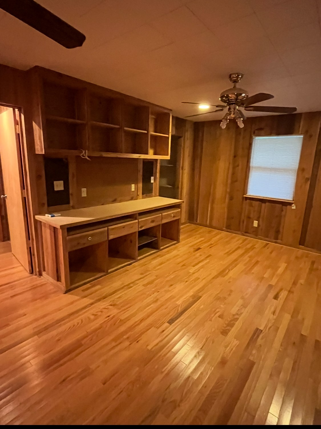 65 Farm To Market Road 3454 Huntsville, TX 77320 - Photo 10 of 37 a bedroom with a bed and a chandelier