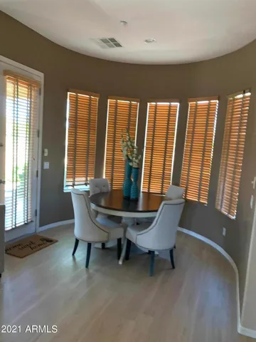 a view of a room with furniture and windows