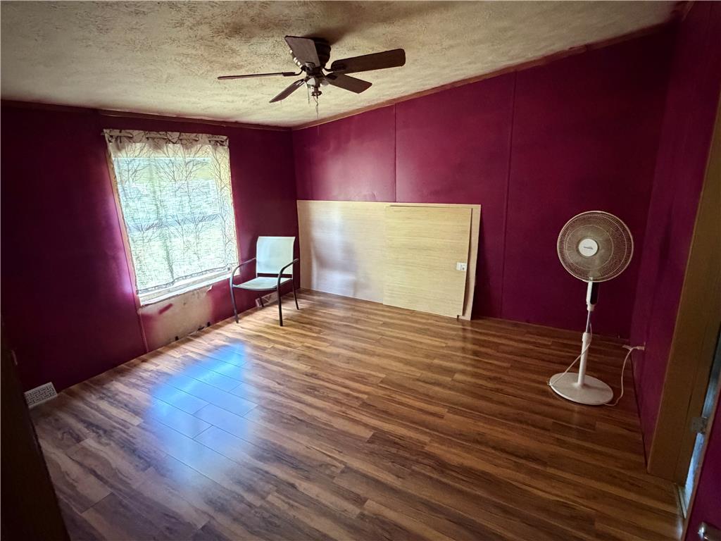 4541 Main Street Slatington, PA 18080 - Photo 16 of 27 A versatile room featuring wood flooring and a window offering natural illumination.