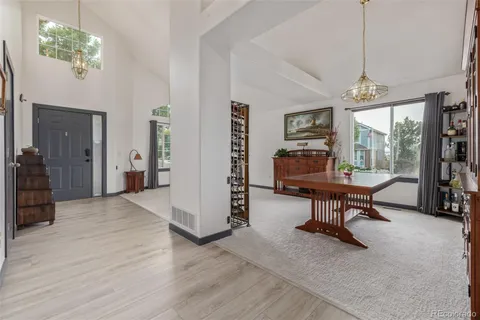 a view of a livingroom with furniture and a window