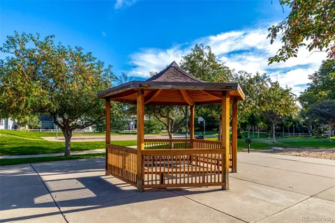 a view of a park with iron fence