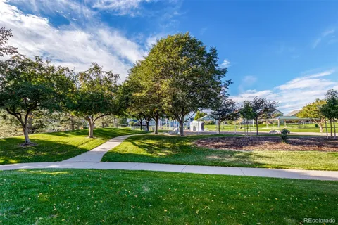 a view of a swimming pool with an outdoor space and seating area