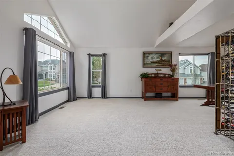 a view of a livingroom with furniture and a window