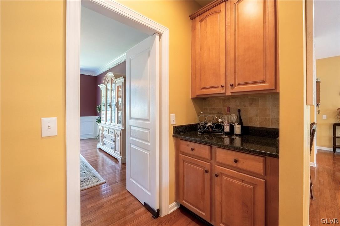 2296 Eldemere Circle Lower Macungie Township, PA 18062 - Photo 14 of 50 a kitchen with granite countertop a sink and cabinets
