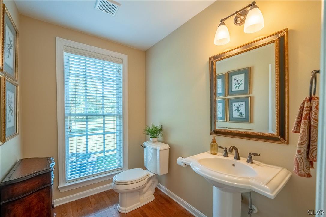 2296 Eldemere Circle Lower Macungie Township, PA 18062 - Photo 20 of 50 a bathroom with a toilet a sink and mirror