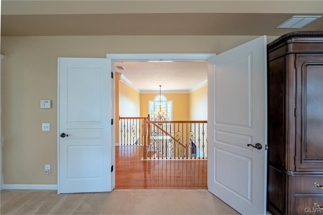 2296 Eldemere Circle Lower Macungie Township, PA 18062 - Photo 28 of 50 a view of a hallway with a door and stairs