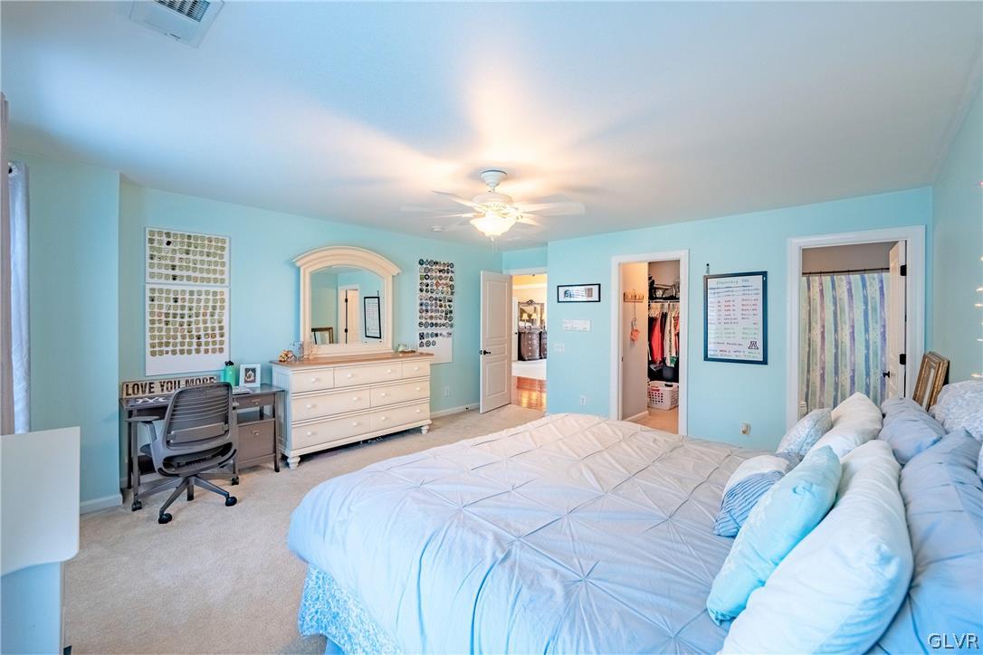 2296 Eldemere Circle Lower Macungie Township, PA 18062 - Photo 30 of 50 a bedroom with a bed wooden floor and furniture