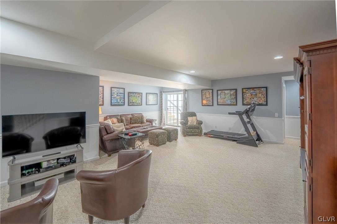 2296 Eldemere Circle Lower Macungie Township, PA 18062 - Photo 37 of 50 a living room with furniture and a flat screen tv