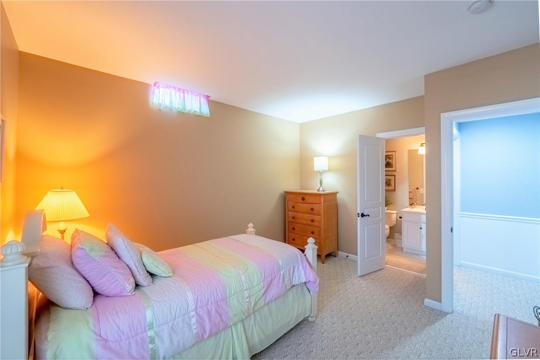 2296 Eldemere Circle Lower Macungie Township, PA 18062 - Photo 39 of 50 a bedroom with a bed and a lamp