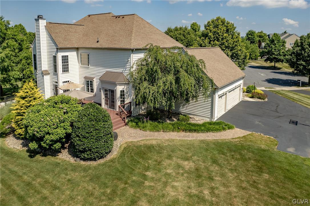 2296 Eldemere Circle Lower Macungie Township, PA 18062 - Photo 45 of 50 a aerial view of a house with a yard and potted plants