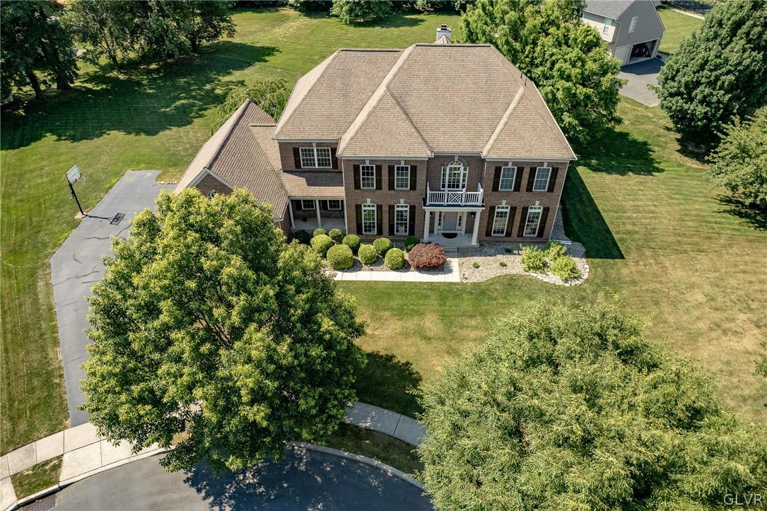 2296 Eldemere Circle Lower Macungie Township, PA 18062 - Photo 47 of 50 an aerial view of a house with swimming pool lake and outdoor seating