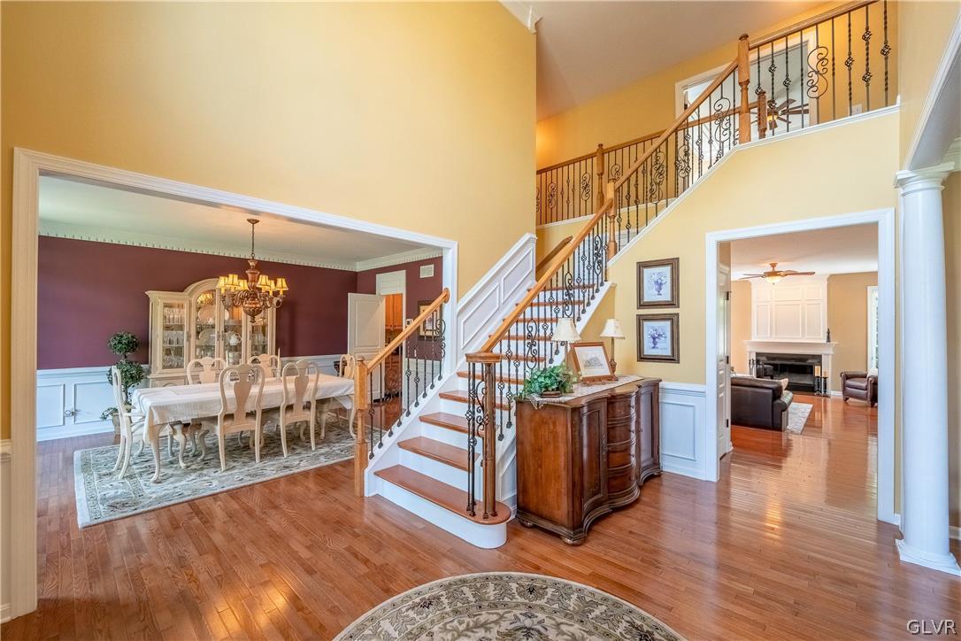 2296 Eldemere Circle Lower Macungie Township, PA 18062 - Photo 7 of 50 a living room with couches and a dining table with wooden floor