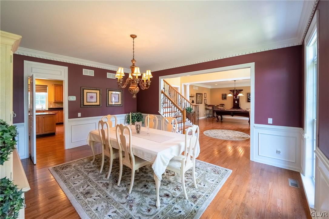 2296 Eldemere Circle Lower Macungie Township, PA 18062 - Photo 9 of 50 a view of a dining room with furniture and wooden floor