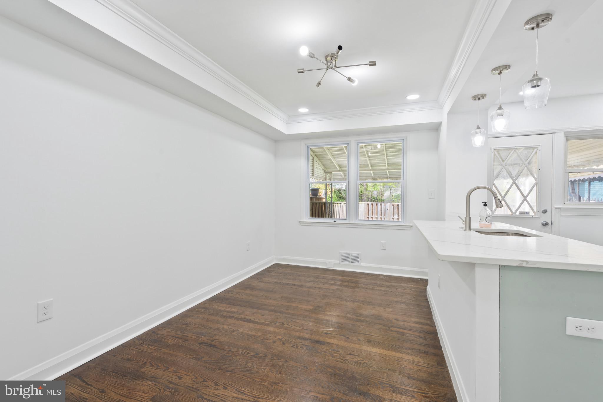 824 Benninghaus Road Baltimore, MD 21212 - Photo 11 of 37 a view of a room with a sink and chandelier