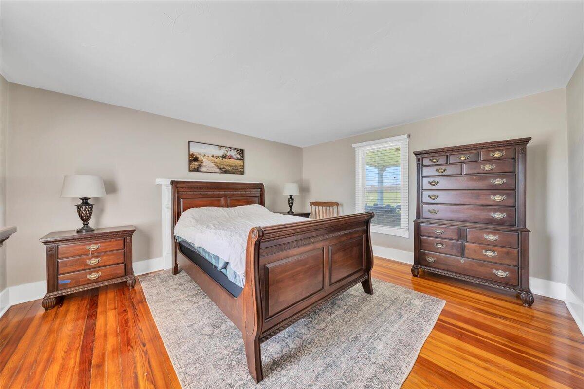 3861 Wheatland Road Bedford, VA 24523 - Photo 17 of 99 a bedroom with a bed and a dresser