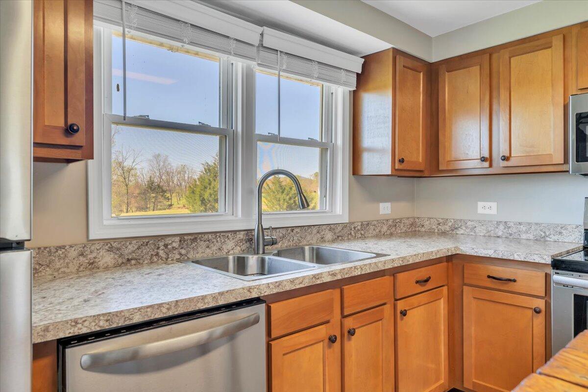 3861 Wheatland Road Bedford, VA 24523 - Photo 26 of 99 a kitchen with stainless steel appliances granite countertop a sink and a cabinets