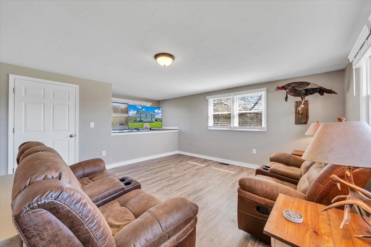 3861 Wheatland Road Bedford, VA 24523 - Photo 34 of 99 a living room with furniture and a window