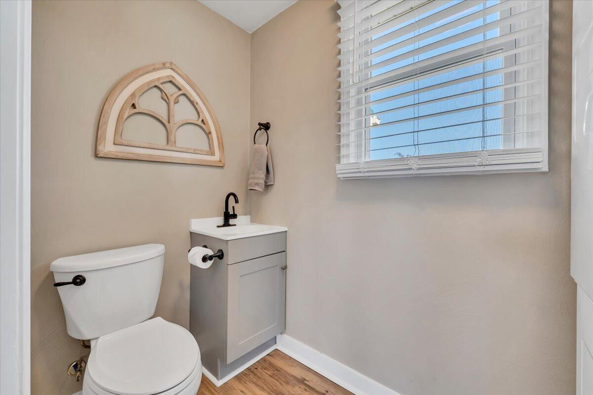 3861 Wheatland Road Bedford, VA 24523 - Photo 35 of 99 a bathroom with a toilet a sink and a window